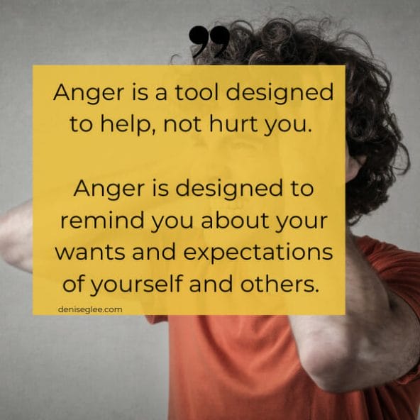 A person holding up a sign that says anger is a tool designed to help, not hurt you.