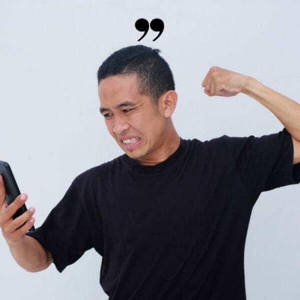 A man with a cell phone in his hand and a quote on the back of it.