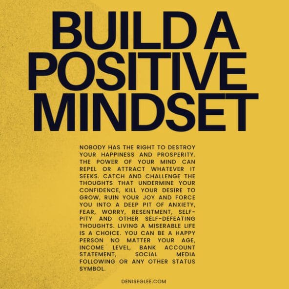 A yellow background with black text that says build a positive mindset.