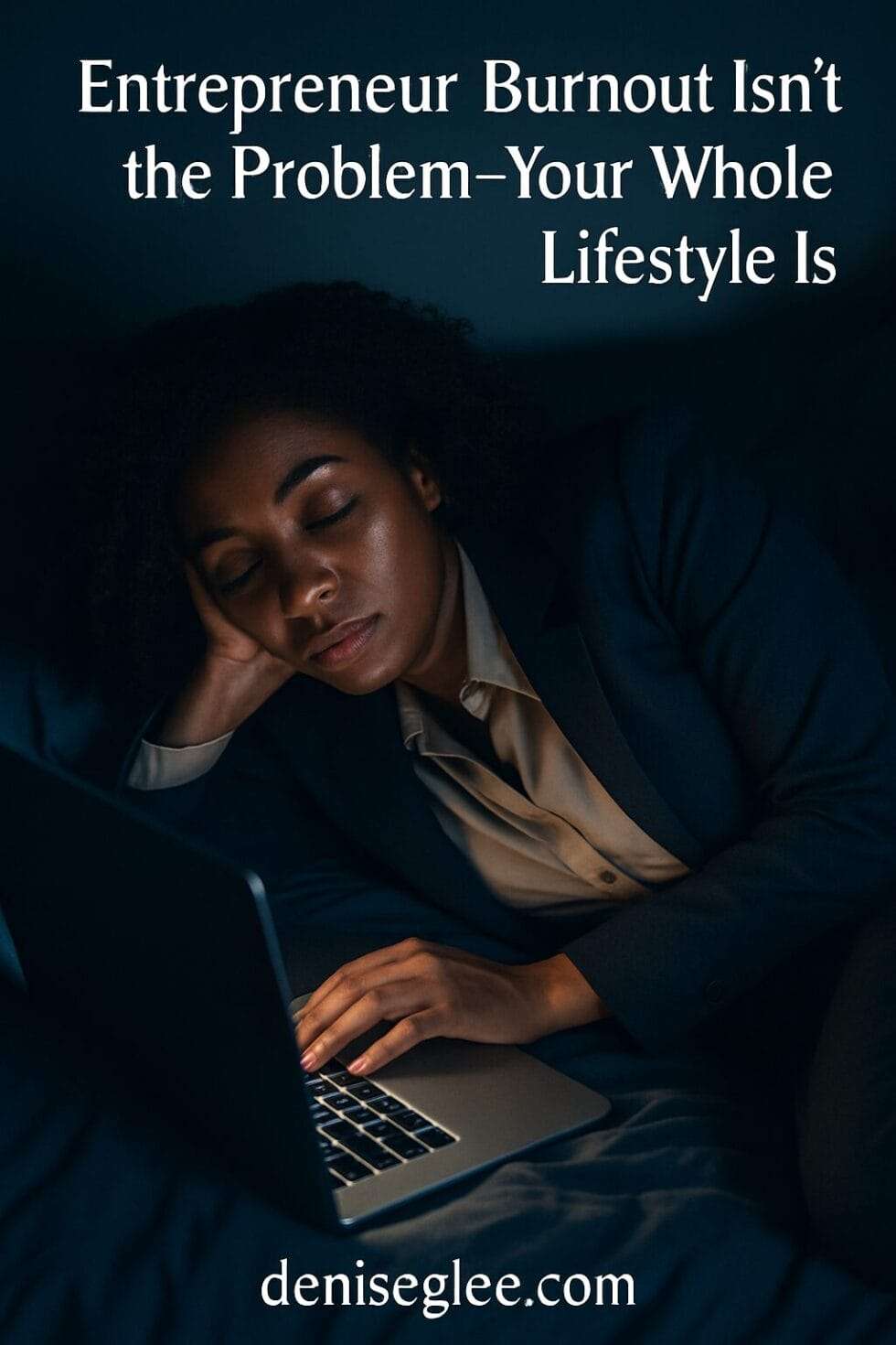 A weary but composed Black woman in her 40s lies on a bed in business attire, her hand resting on a glowing laptop as she drifts off, symbolizing the long-term toll of entrepreneurial burnout.