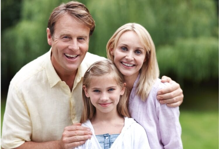 image of a white family. mom, dad and female child.