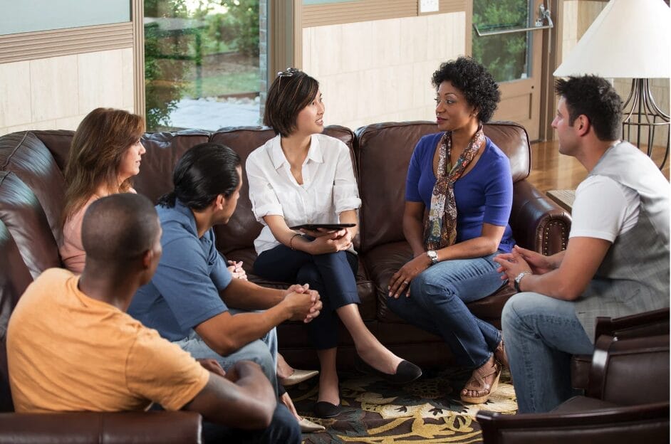 group of people sitting on a couch