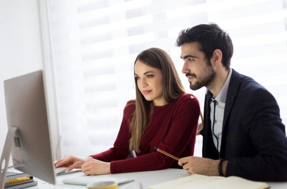 man-and-woman-looking-at-computer