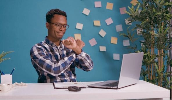 man rejecting something he sees on laptop