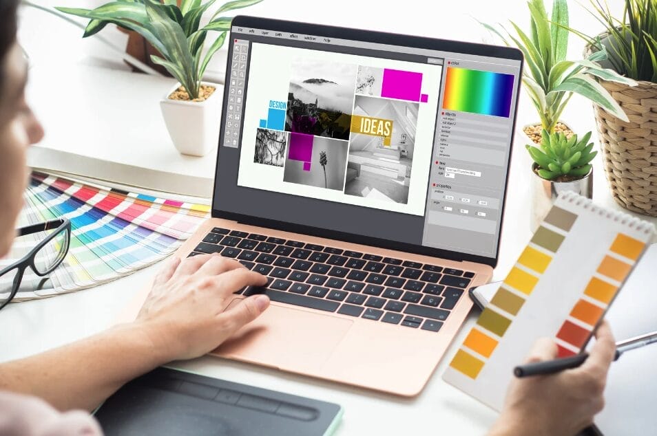 woman-holding-a-color-pallete-while-looking-at-laptop