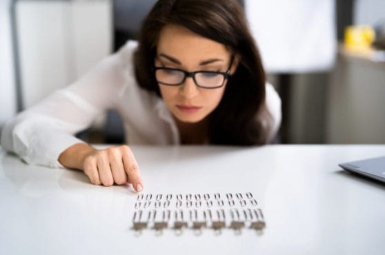 woman lining up pencils
