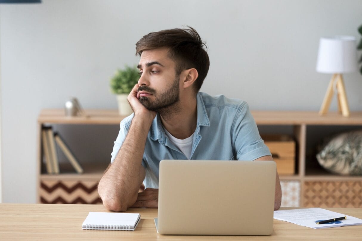 man looking away laptop