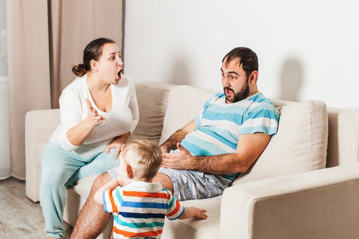 mom yelling at dad while son watches