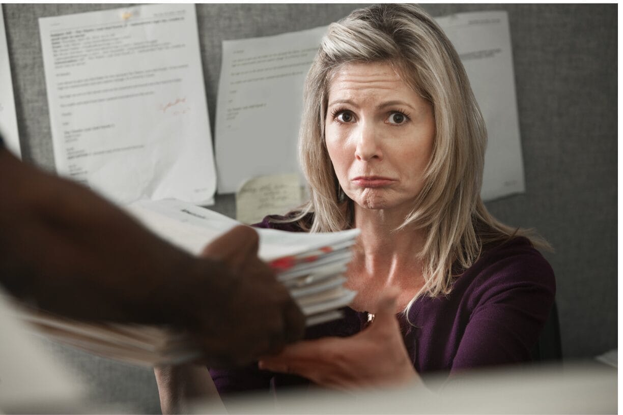 upset woman receiving paperwork