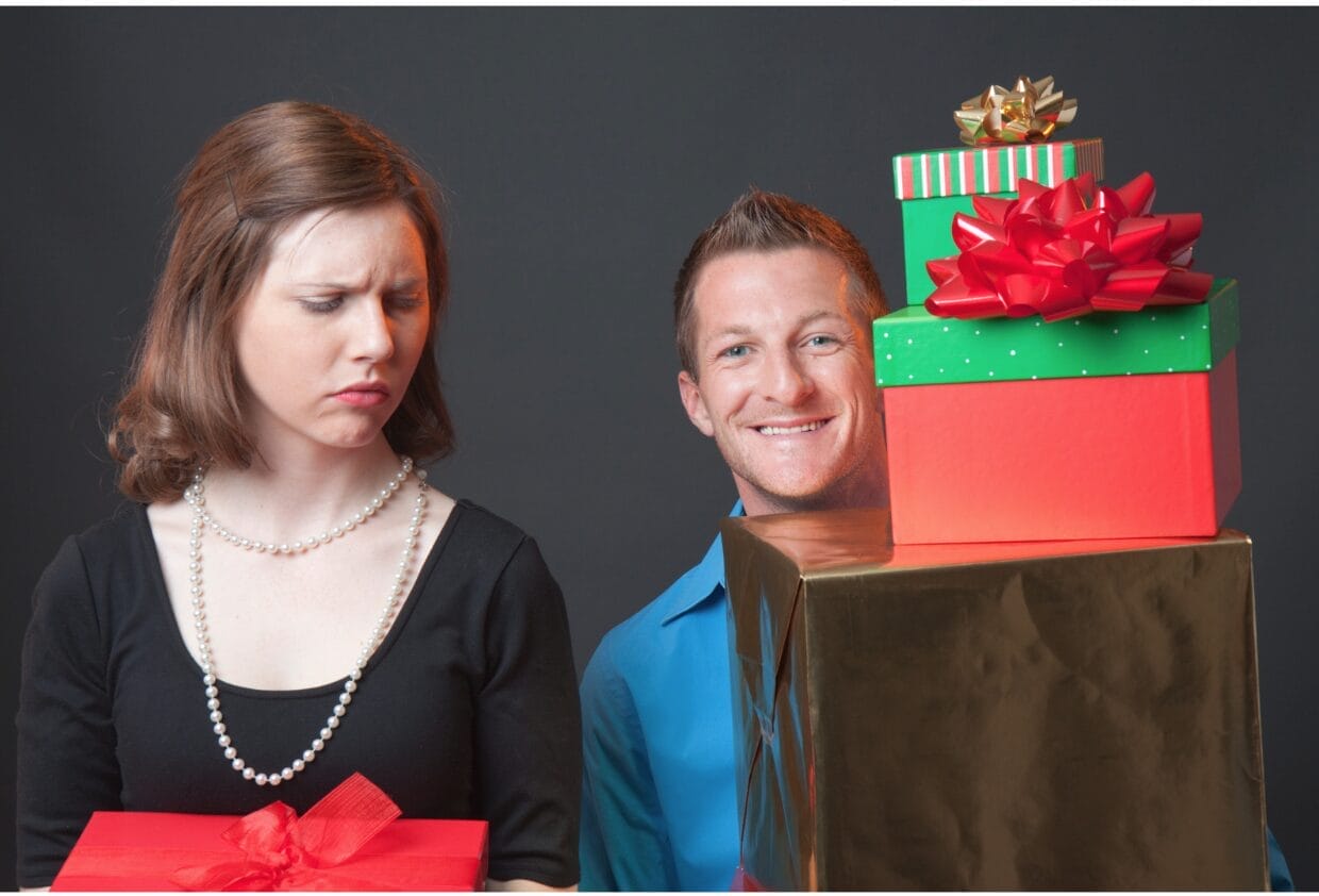 woman looking at man upset that has boxes in his hands