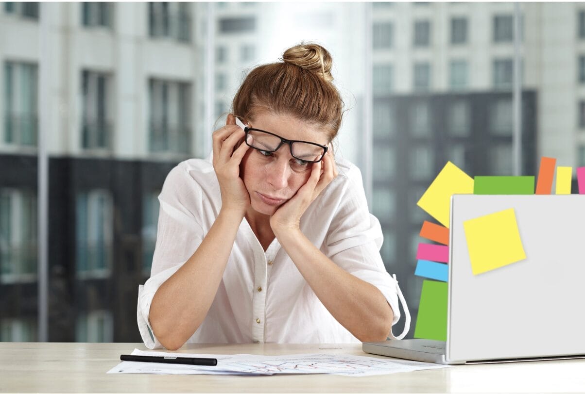 exhausted woman with tons of sticky notes