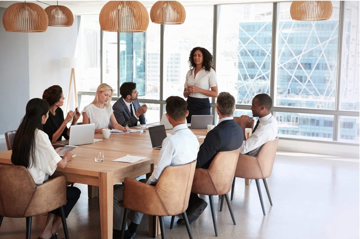 meeting where one woman is standing