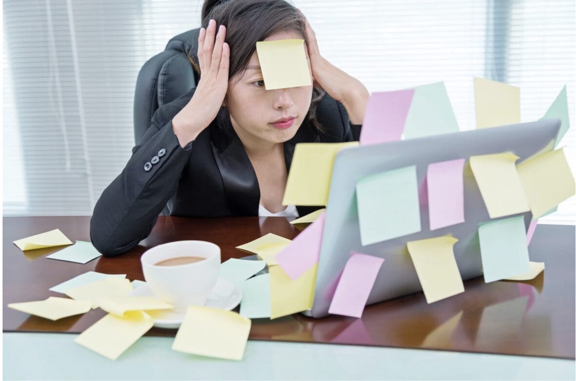 woman with stickies on herself and her laptop