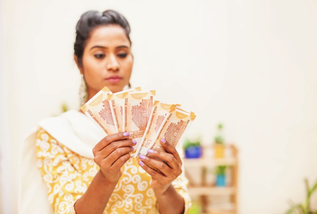 Indian woman holding money