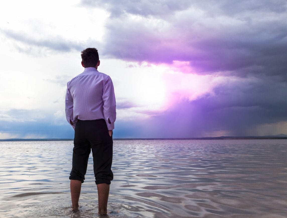 man staring into the water