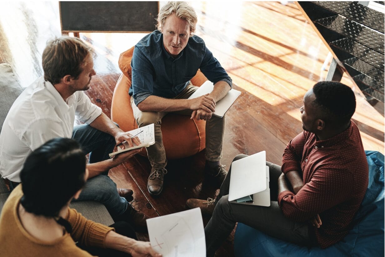 man talking in an informal meeting