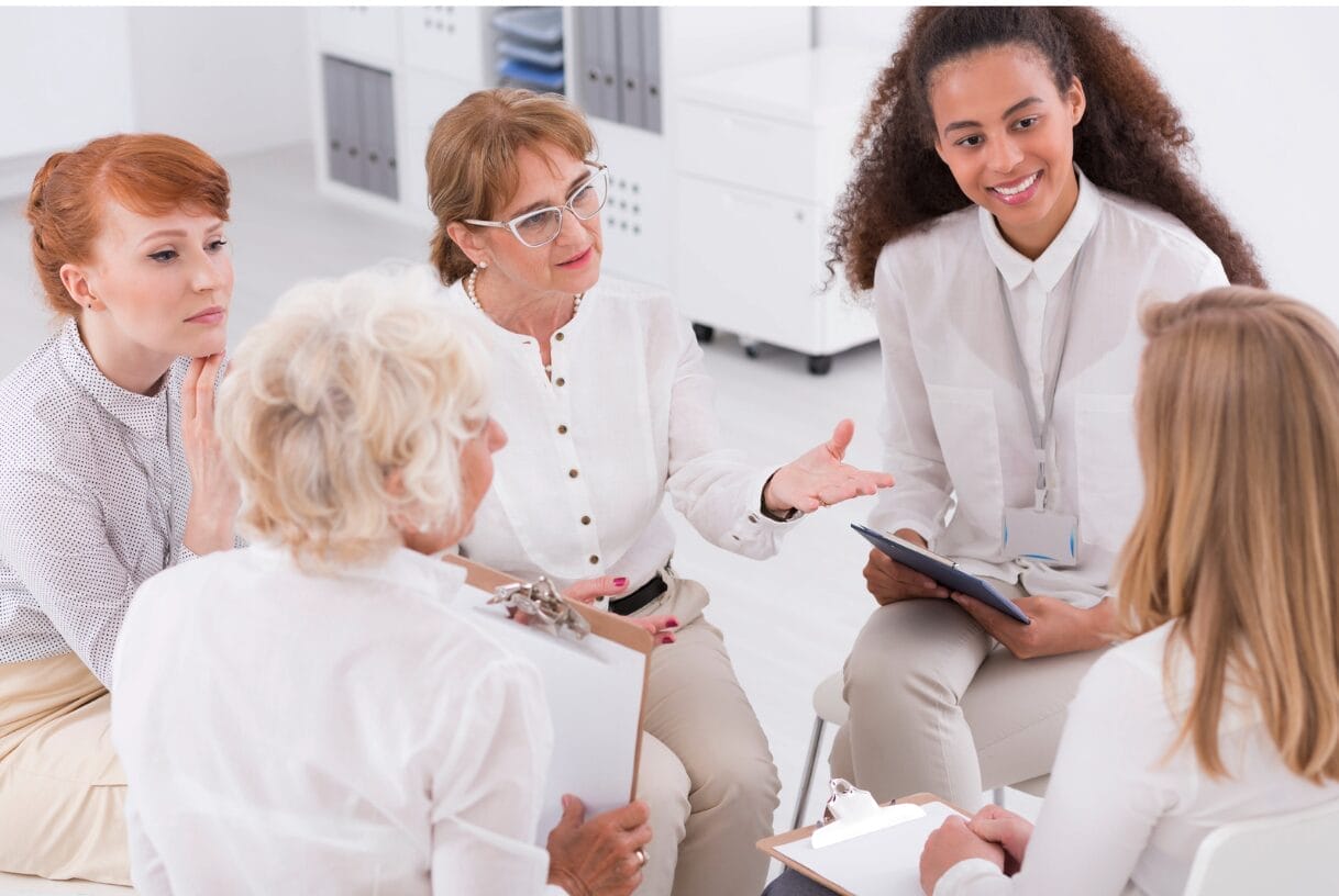 older woman in a group talking