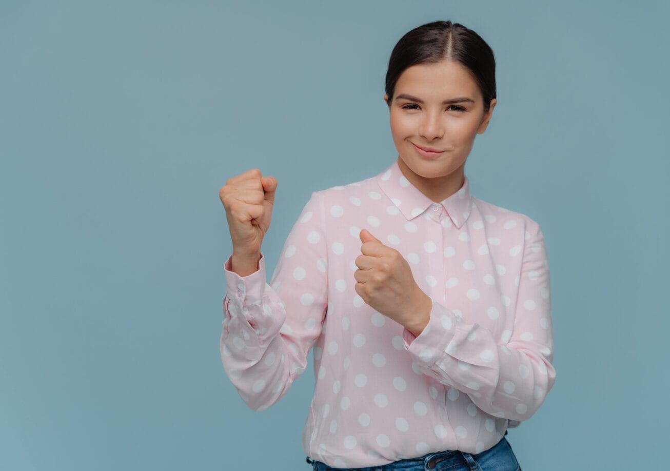 woman with her fists raised