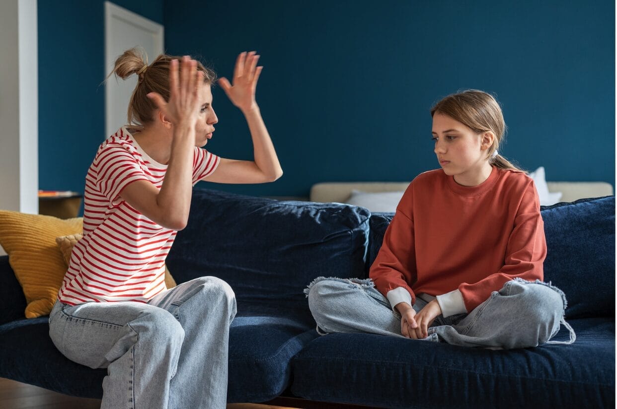 mom yelling at daughter while on couch