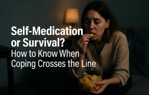A tired woman in work clothes sits in a dimly lit room, eating chips out of boredom and stress, with a distant expression on her face.