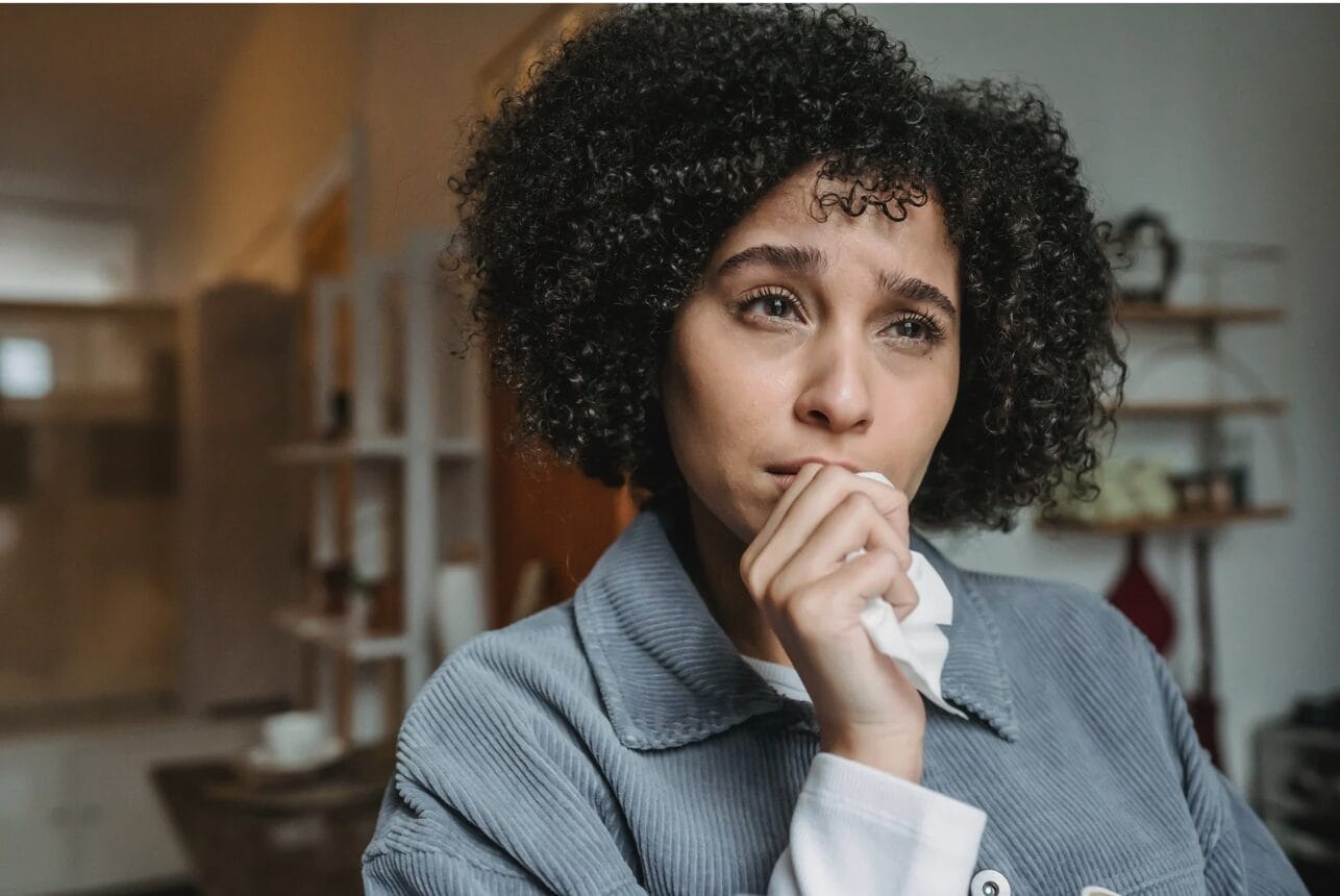 upset woman with curly hair