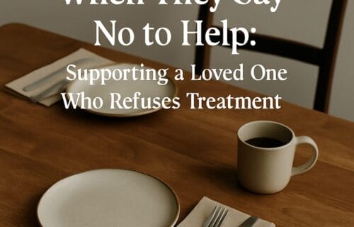 Table set for two with one empty chair, symbolizing emotional distance and resistance to help