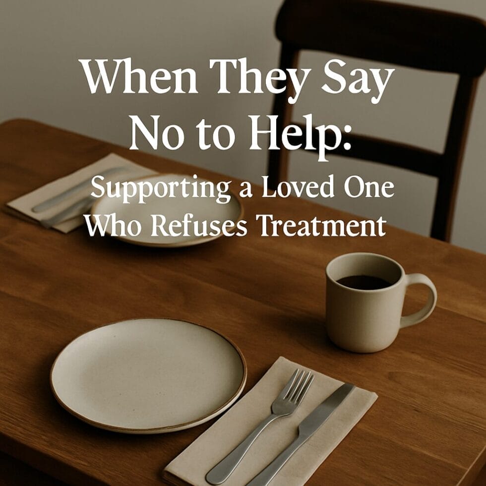 Table set for two with one empty chair, symbolizing emotional distance and resistance to help