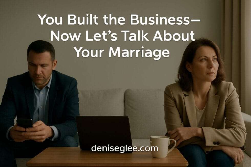 A couple sitting at opposite ends of a couch, dressed for work, not speaking—symbolizing emotional distance in high-performing relationships.