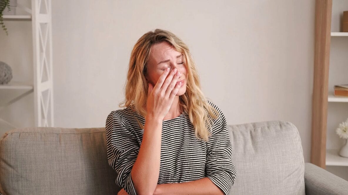 woman on couch drying