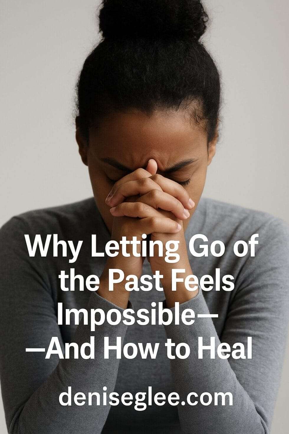Woman holding her forehead in a moment of reflection and emotional heaviness