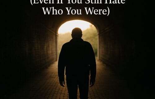 Silhouette of a person walking out of a dark tunnel into daylight, symbolizing recovery and self-forgiveness after addiction